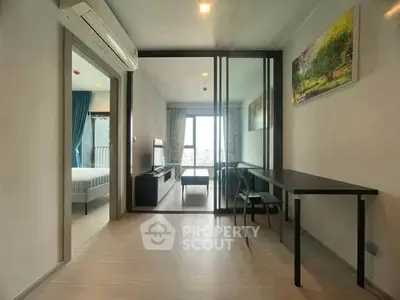 Modern apartment interior with glass partition and natural light