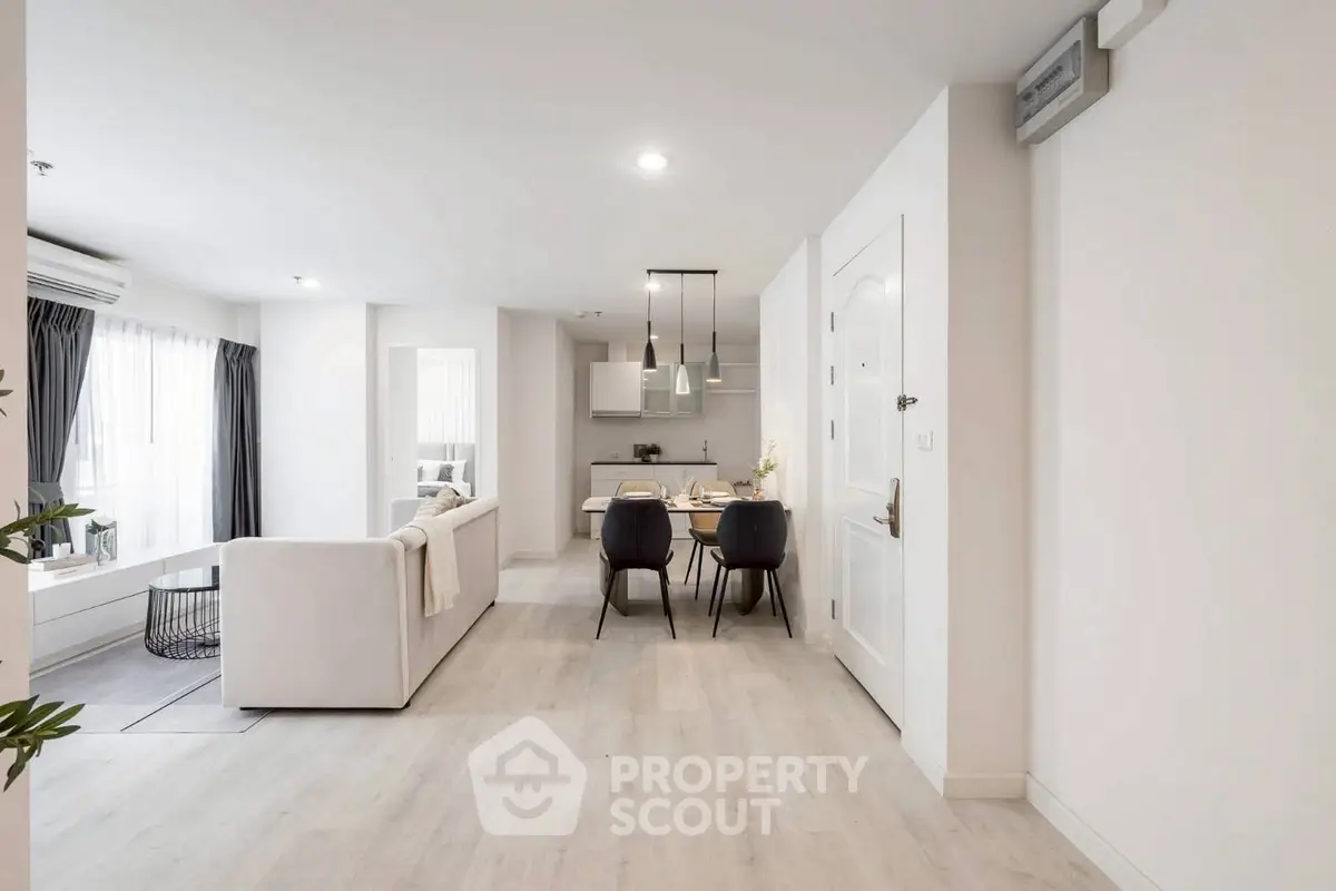 Modern open-plan living and dining area with stylish decor and natural light.