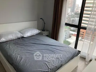 Modern bedroom with city view and natural light