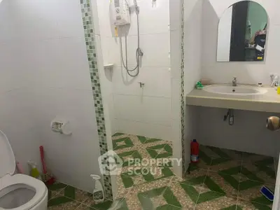 Spacious bathroom with modern shower and stylish tile flooring