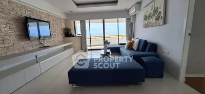 Modern living room with ocean view and stylish blue furniture