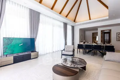 Luxurious open-plan living room with high ceilings and elegant dining area, featuring modern furniture and large windows.