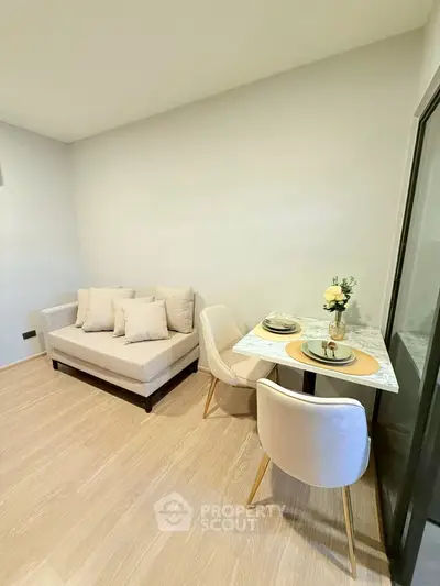 Cozy modern living room with elegant dining set and plush sofa