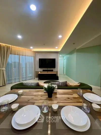 Spacious modern living room with elegant dining setup and ambient lighting