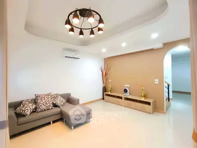 Modern living room with stylish lighting and cozy seating area