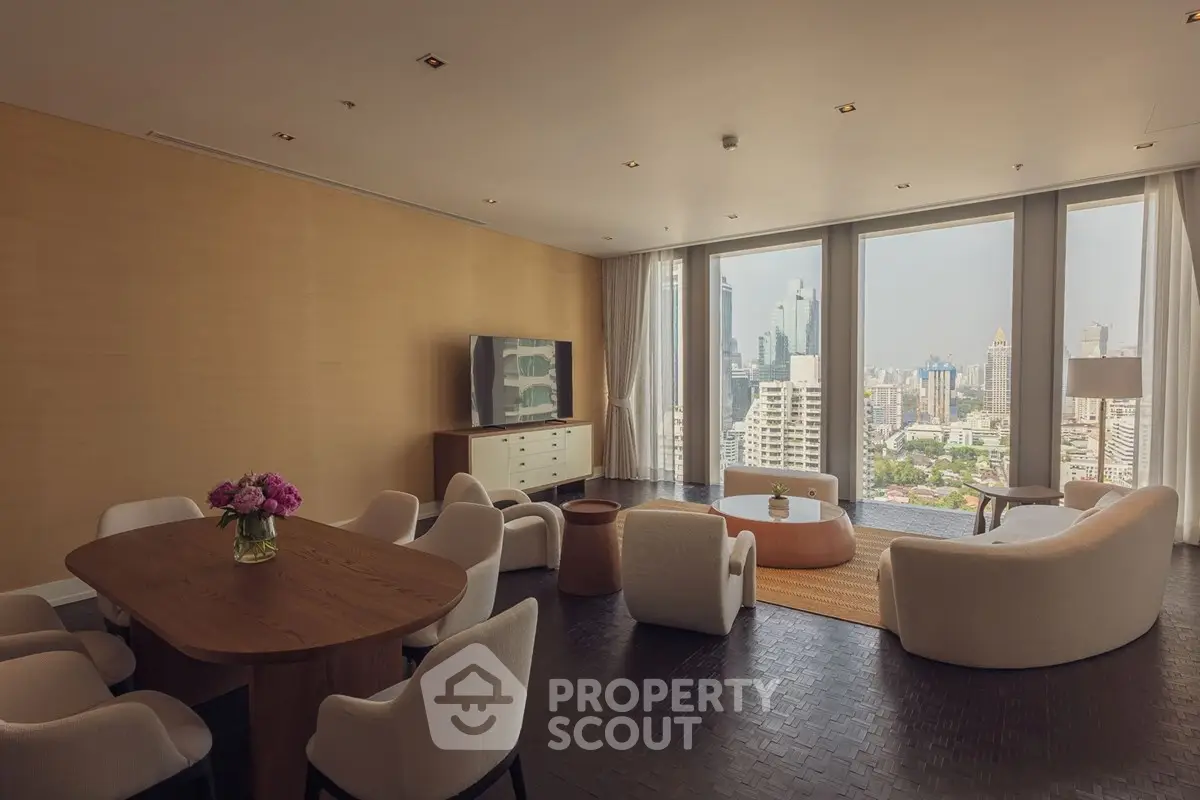 Luxurious living room with panoramic city view, elegant furniture, and modern decor in high-rise apartment.