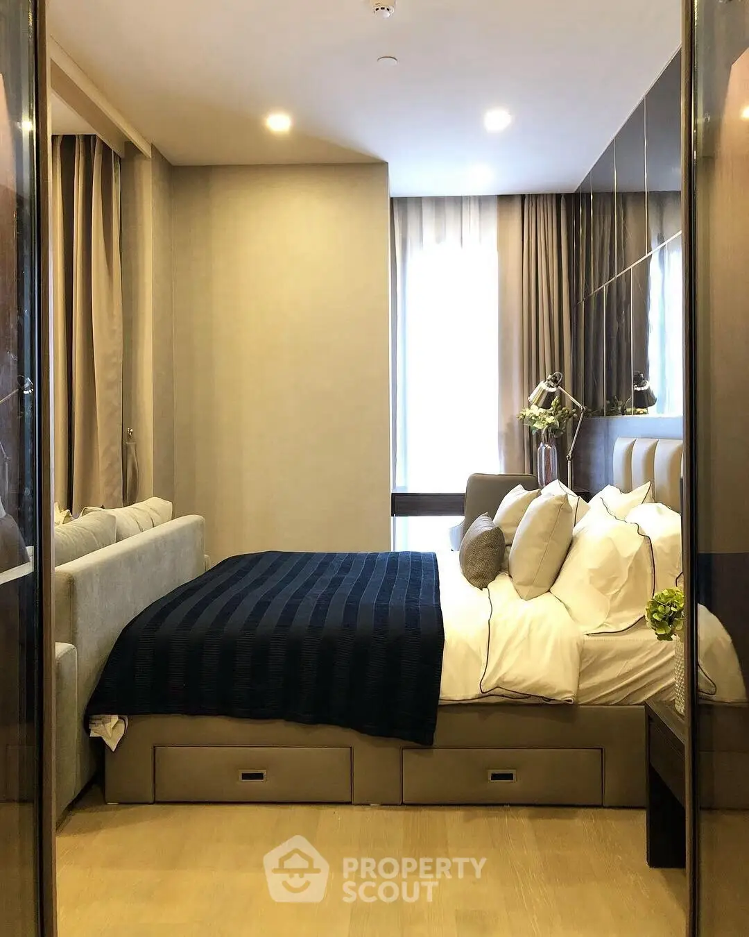 Luxurious bedroom with modern decor and ample natural light