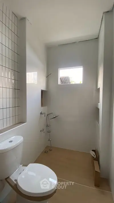 Modern minimalist bathroom with natural light and sleek fixtures