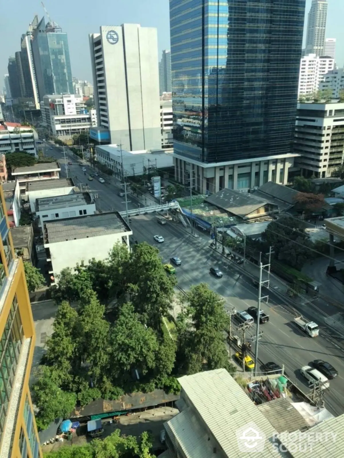 Stunning cityscape view from high-rise building showcasing urban skyline and bustling streets.