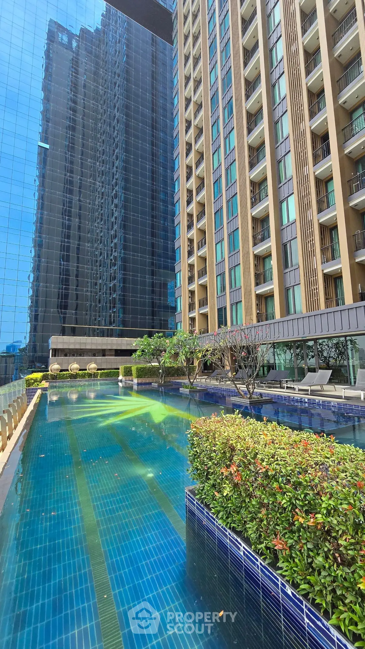 Luxurious high-rise building with stunning pool and modern architecture