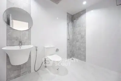 Spacious modern bathroom with sleek fixtures and elegant tile design