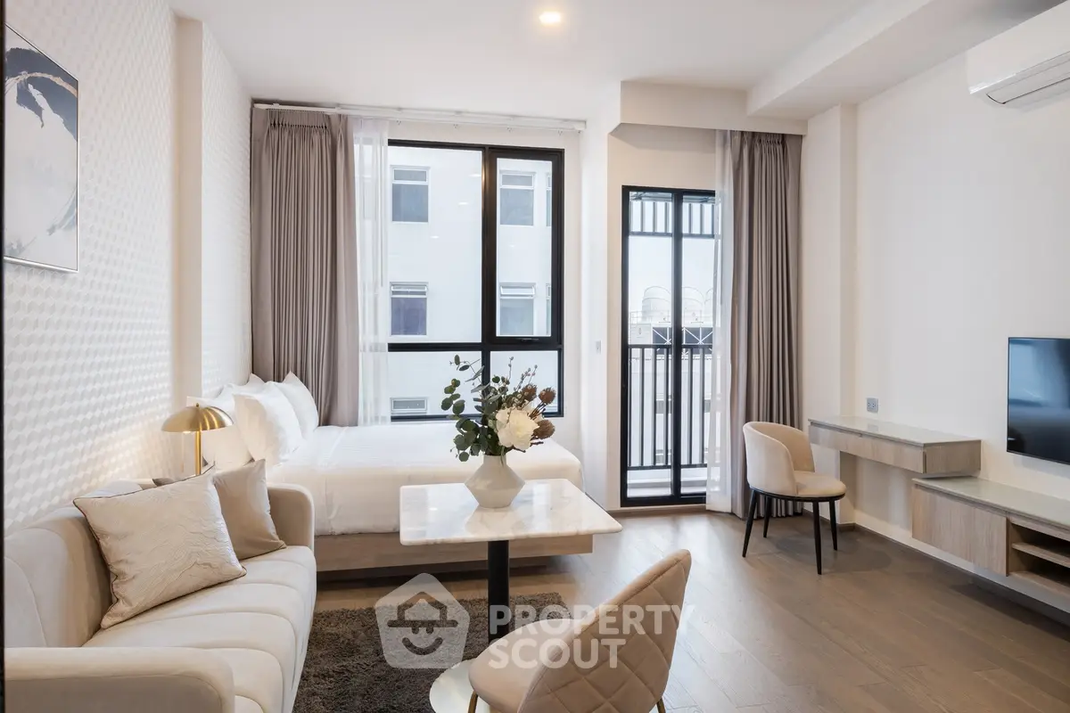 Modern studio apartment with elegant decor and natural light