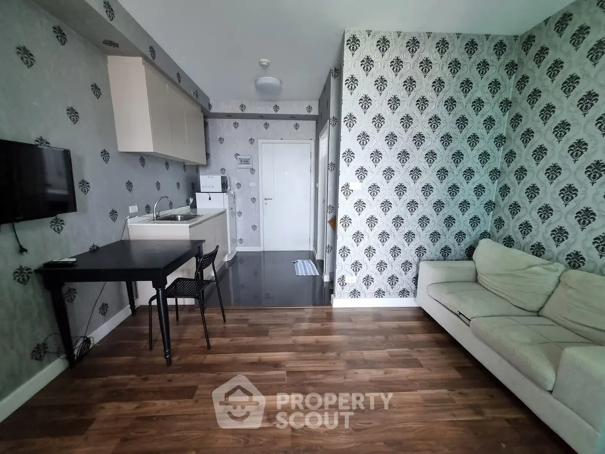 Stylish living room with modern wallpaper and cozy sofa in a chic apartment