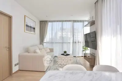 Modern living room with large windows and stylish decor