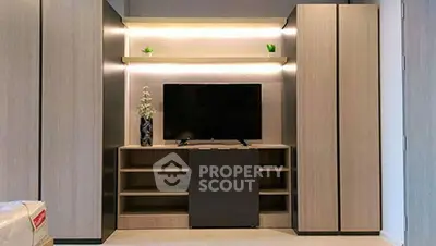 Modern living room with sleek TV unit and ambient lighting