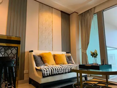 Stylish living room with elegant decor and large windows offering natural light.