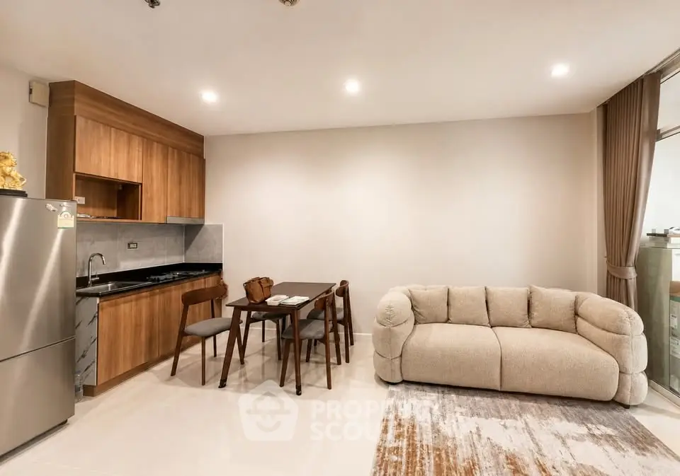 Modern open-layout kitchen and living room with cozy sofa and dining area