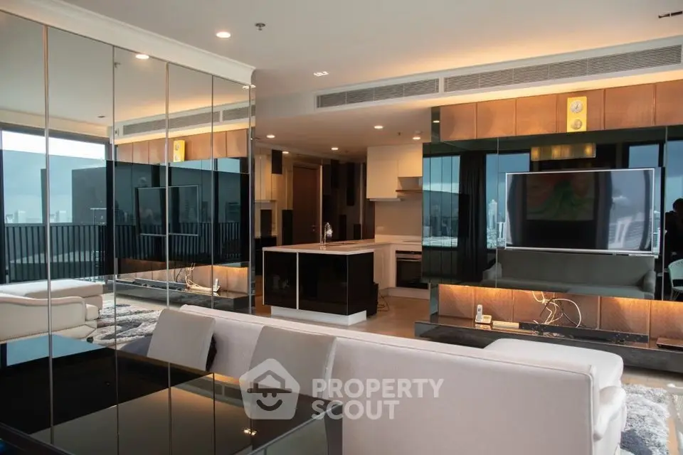 Luxurious modern living room with open kitchen and stunning city view