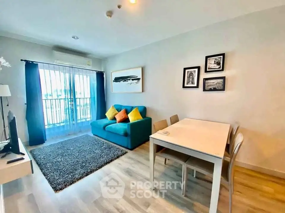 Bright and modern living room with balcony access in a stylish apartment.