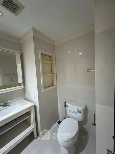 Modern bathroom with sleek fixtures and ample storage space