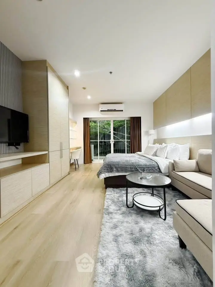 Modern studio apartment with cozy living area and stylish decor