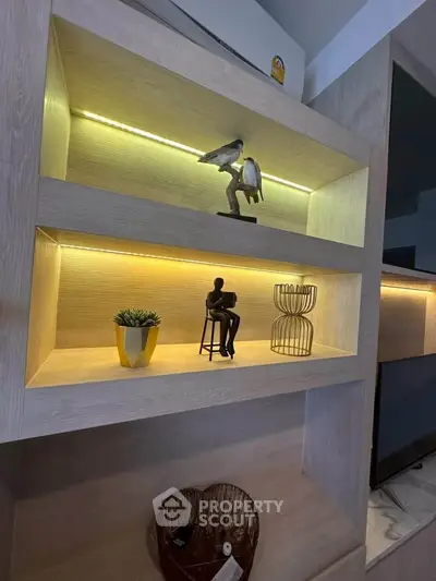 Modern interior shelving with decorative items and ambient lighting