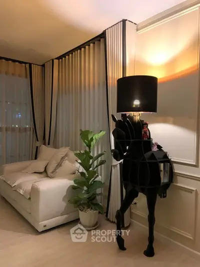 Elegant living room with unique horse lamp and cozy sofa