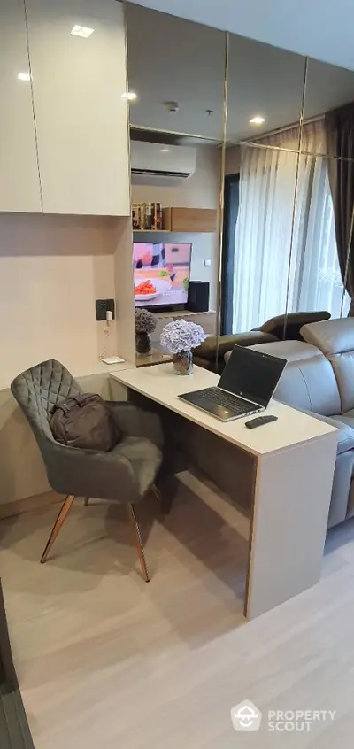 Modern study area with sleek desk and comfortable chair in stylish apartment