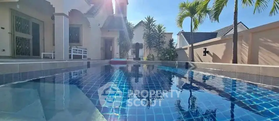 Luxurious villa with private pool and tropical garden, perfect for relaxation and leisure.