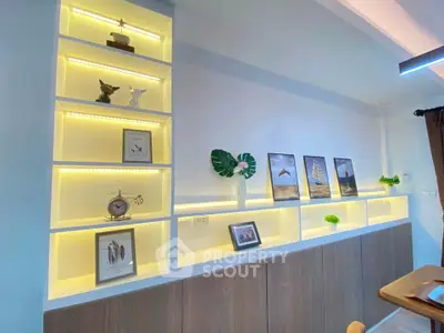 Stylish living room with illuminated shelves and modern decor