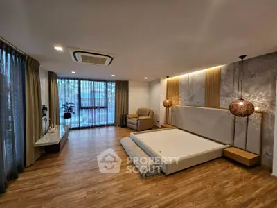 Spacious modern living room with stylish decor and large windows