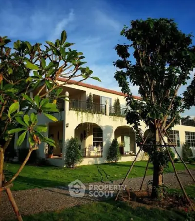 Charming two-story house with lush garden and spacious balcony