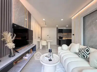 Modern living room with sleek design, open layout, and stylish decor in a contemporary apartment.
