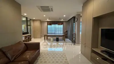 Spacious modern living room with leather sofa and stylish decor