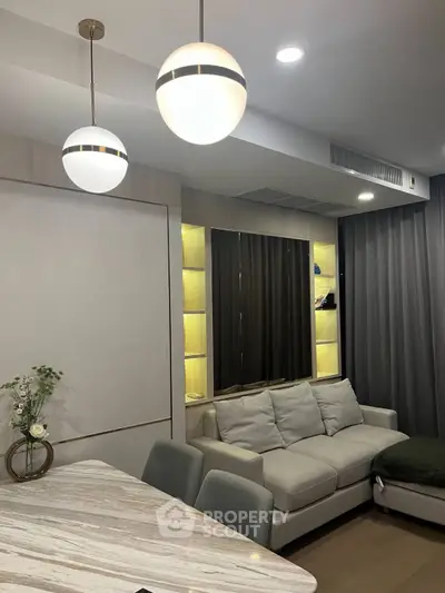 Modern living room with stylish lighting and cozy seating area