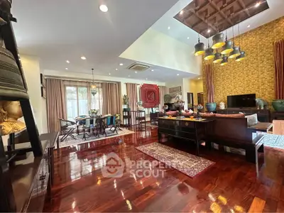 Luxurious open living room with elegant decor and polished wooden floors