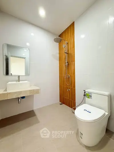 Modern bathroom with sleek fixtures and rainfall showerhead