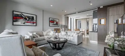 Luxurious modern living room with elegant decor and spacious seating area.