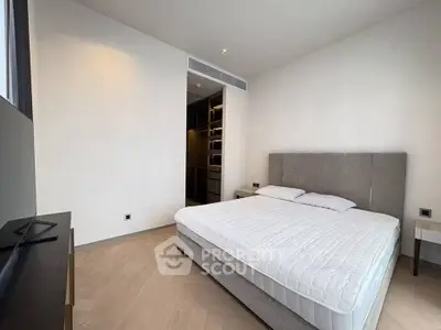 Spacious modern bedroom with elegant design and walk-in closet