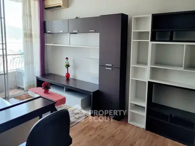Modern living room with stylish shelving and balcony view