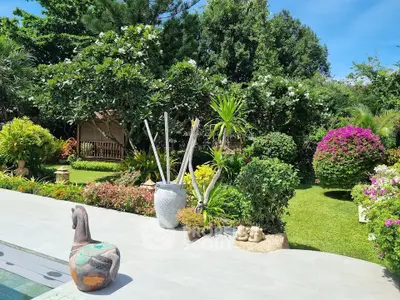 Lush garden oasis with vibrant flowers and greenery, perfect for relaxation and outdoor enjoyment.