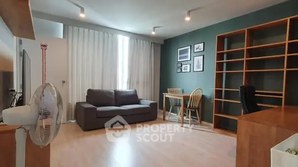 Spacious living room with modern decor and natural light