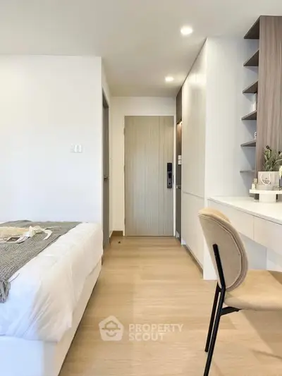 Modern bedroom with minimalist design and cozy workspace