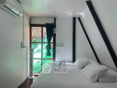 Cozy bedroom with modern air conditioning and natural light