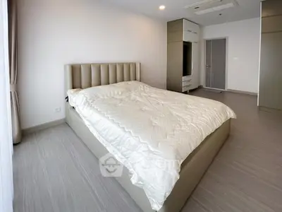 Spacious modern bedroom with elegant design and natural light