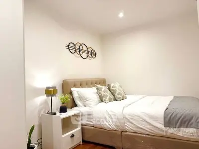 Cozy bedroom with modern decor and plush bedding