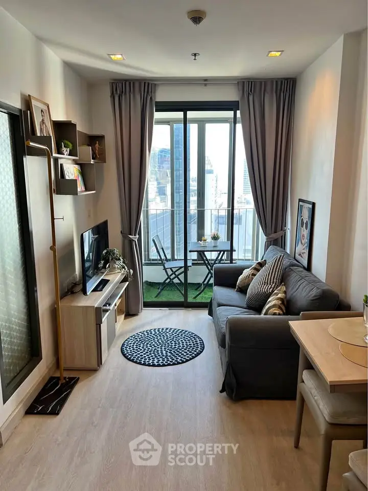 Modern living room with balcony view in high-rise apartment