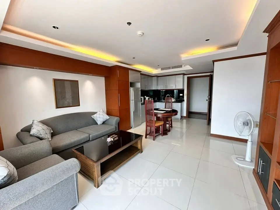 Spacious modern living room with open kitchen and stylish furniture