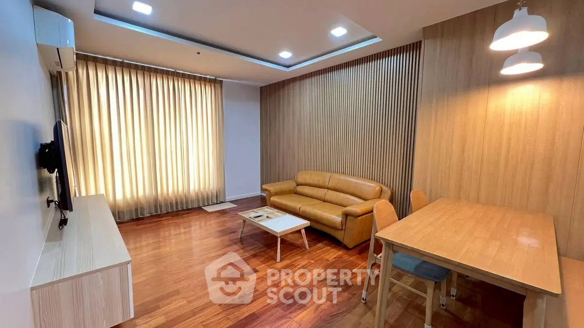 Modern living room with wooden flooring and stylish furniture