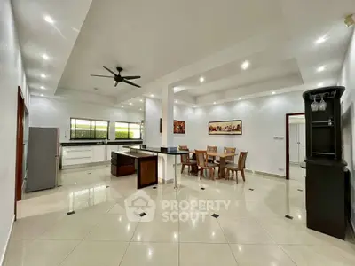 Spacious open-layout kitchen and dining area with modern fixtures and ample natural light.